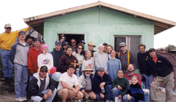 Group picture in front of house